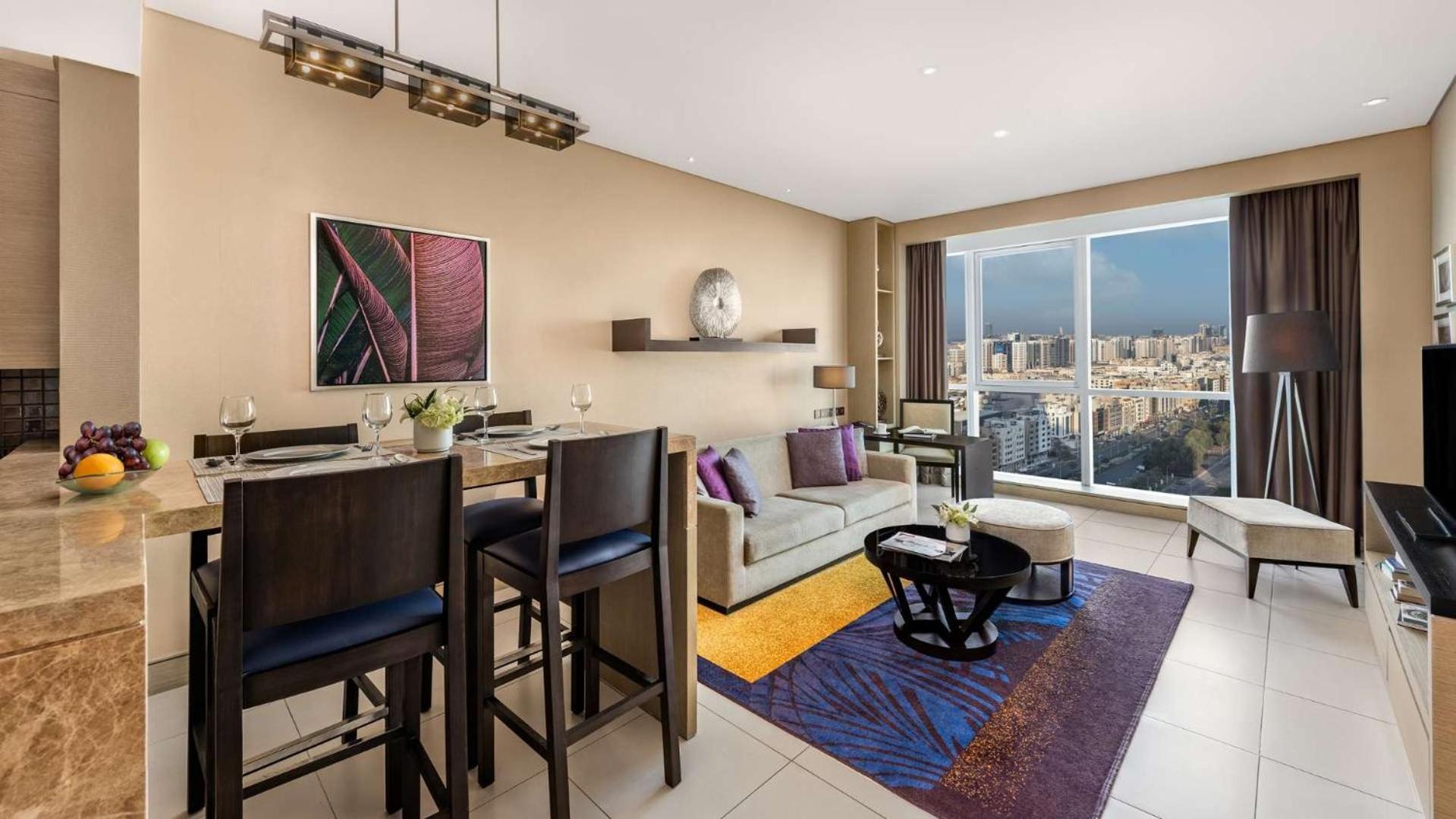 Dusit Thani Abu Dhabi Exterior photo A living room at the Ritz-Carlton, Downtown, Dubai